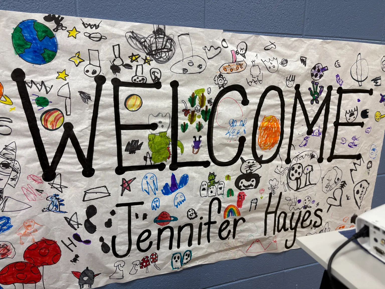 Students and Jennifer Hayes in the classroom during a Jenny Figment author visit.